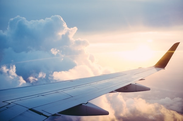 an image of the wing of an airplane in the sky